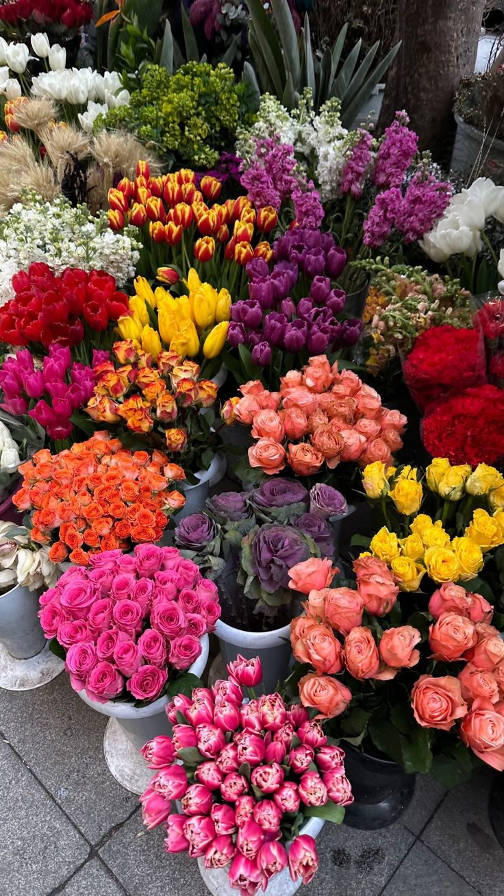 Artisan bouquets resting fresh inside glass water vases