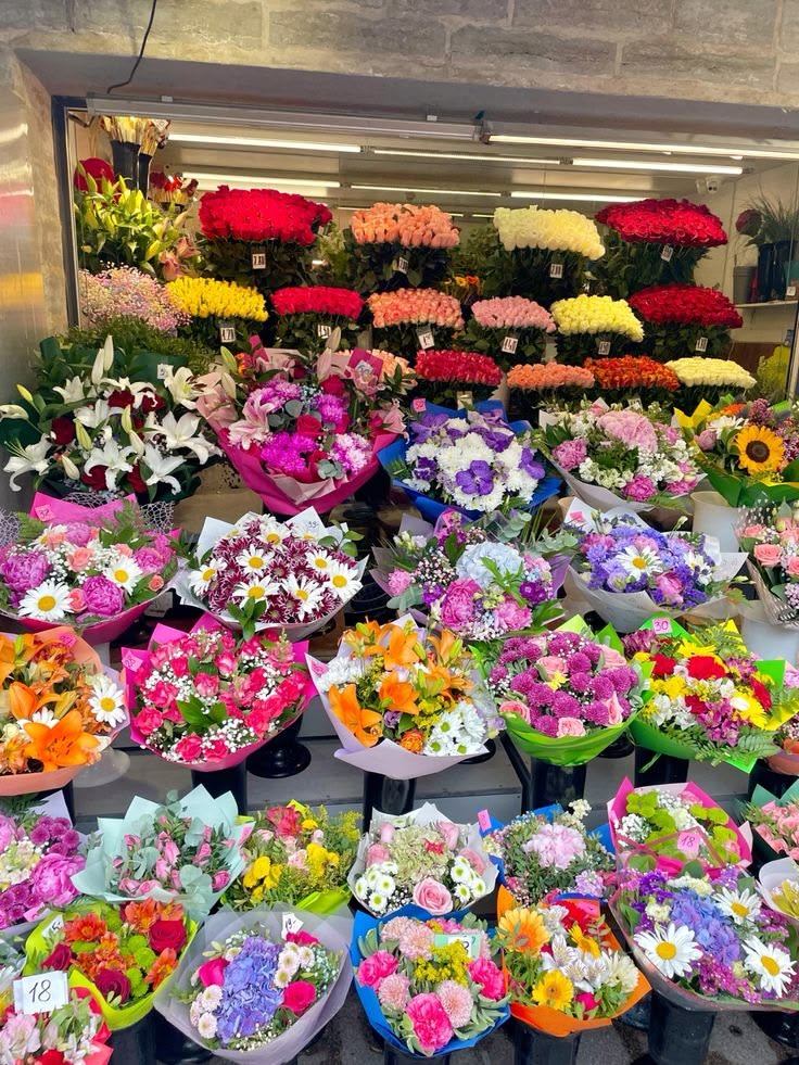 Fresh floral supplies stacked near an arrangement station